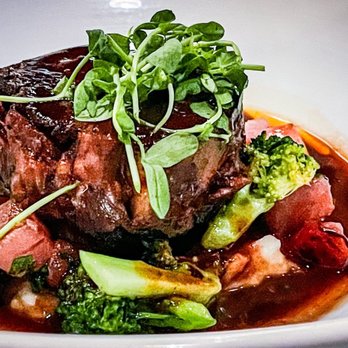 The Crossing STL signature dishes  Menu changes seasonally, but often includes items like Pan-Seared Scallops, various preparations of fish and prime meats, creative pasta dishes, and sophisticated desserts. Tasting menus are a highlight.